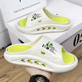 Men's white and green colour block EVA slippers with a thick, textured sole.