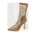 Gold mesh high heel sandals with a pointed toe and stiletto heel on a rubber sole.