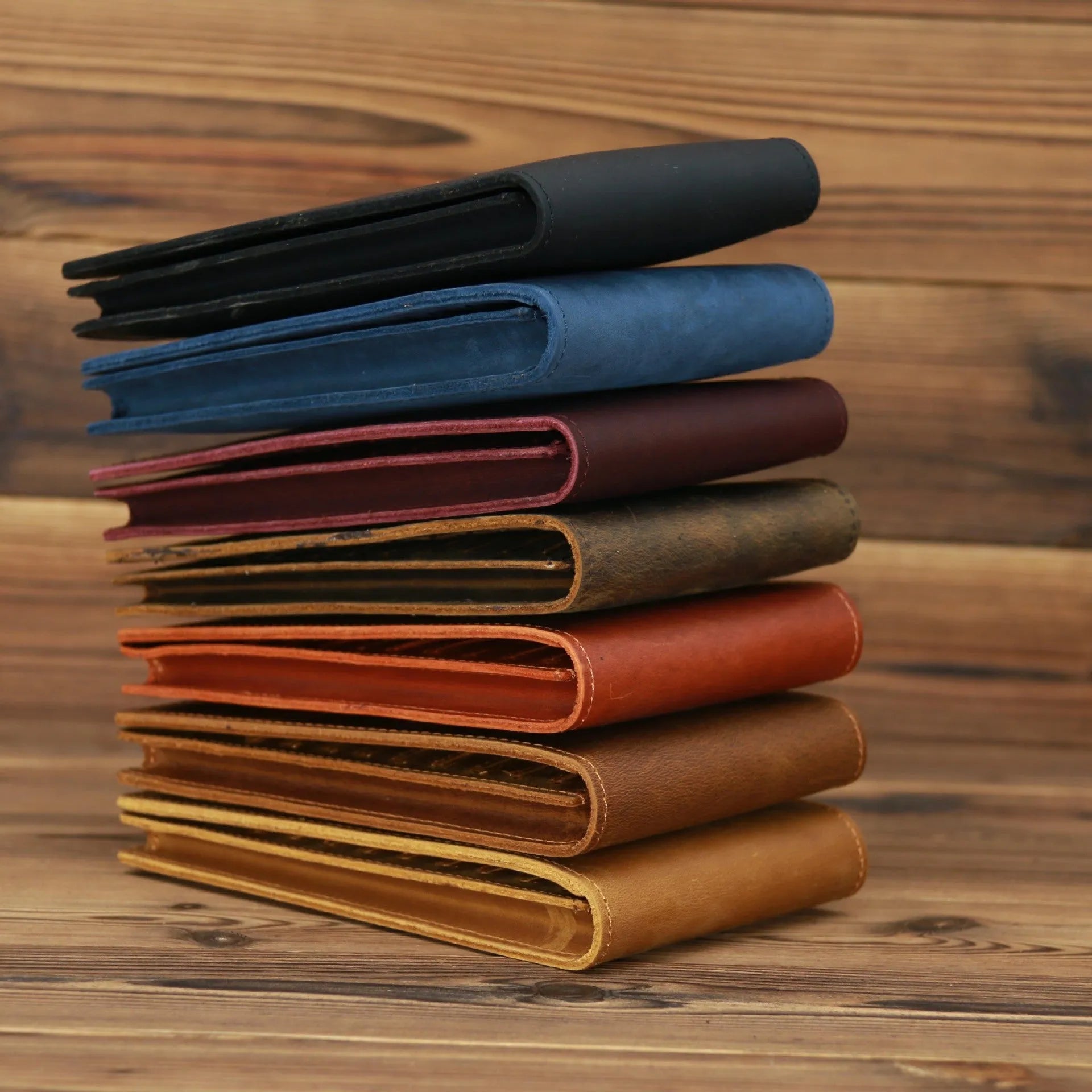 Men's black cowhide leather card holder wallet open to show 18 card slots, money pocket, and phone pocket.