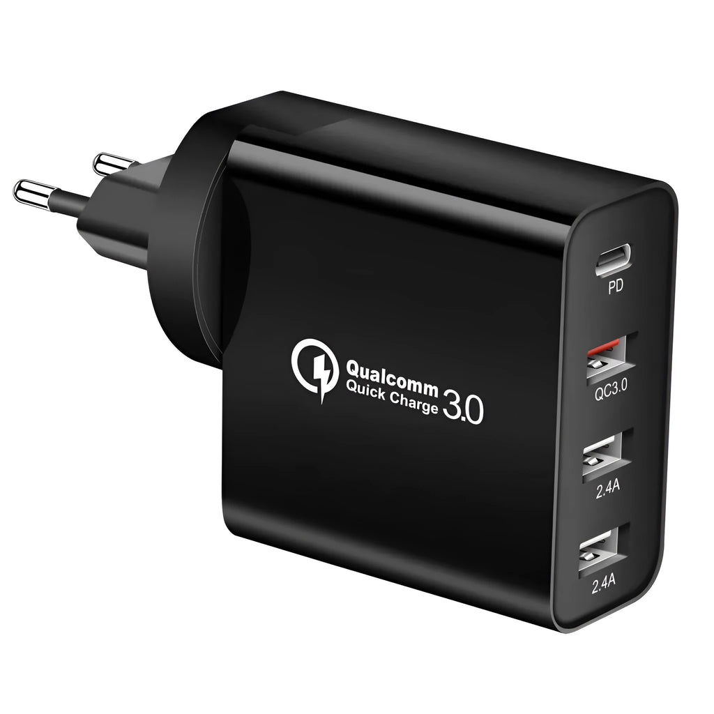 White 4-port USB fast charger with UK plug on a wooden surface.