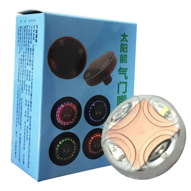 Solar powered colourful wheel hub lamp attached to car tyre valve with flashing light