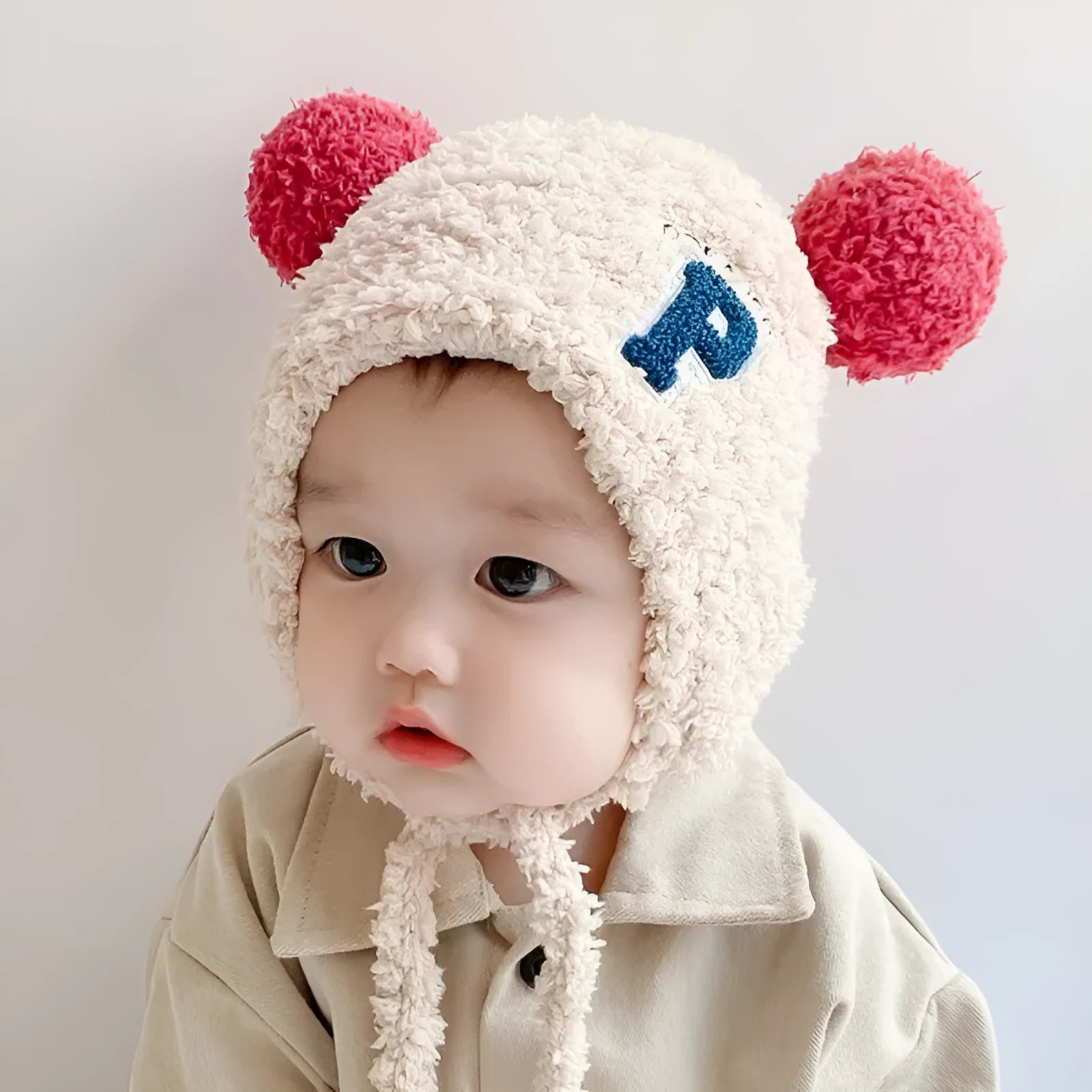 Cute lamb wool baby plush hat in beige colour with 10cm depth for 0-24 months