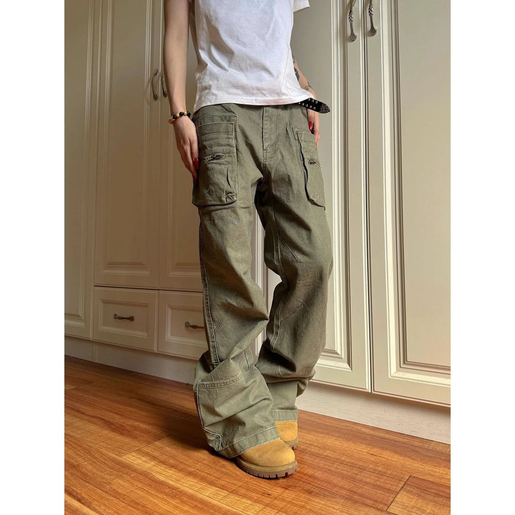 Green and black cotton casual trousers with double zipper detail and pockets on a mid-waist design.