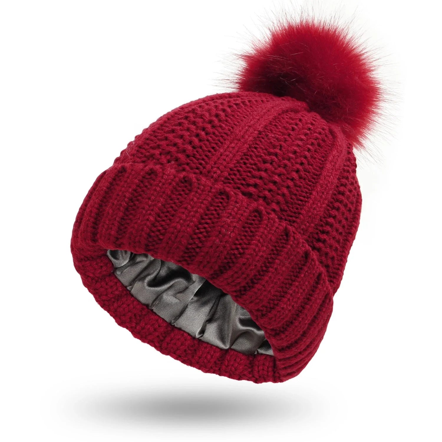 Cozy knit beanies with satin lining, paisley pattern, and faux fur pom poms in a variety of colors