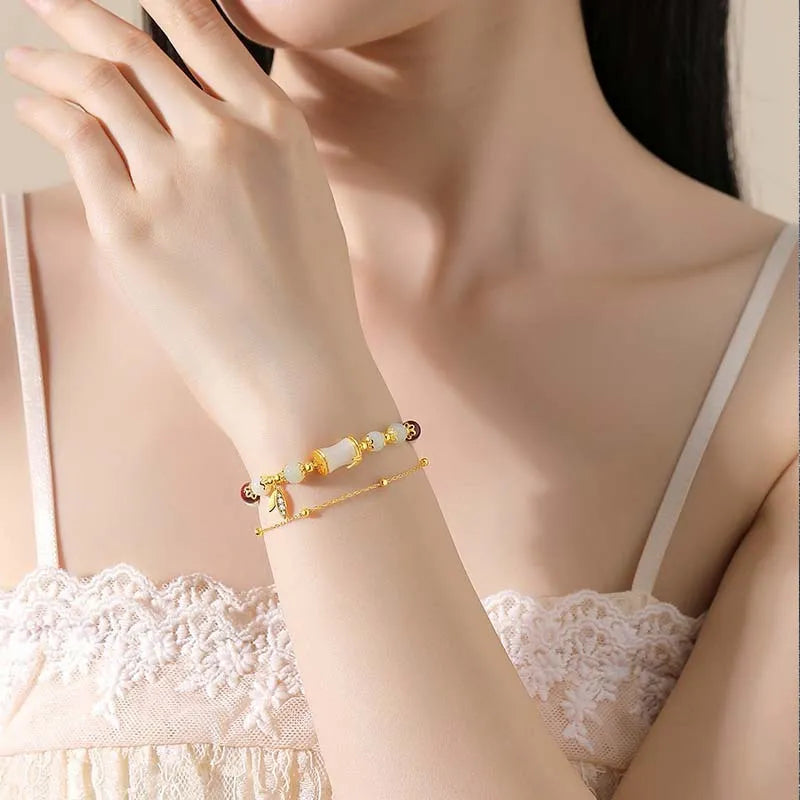 Bamboo-themed bracelet with ruyi motif and coloured flower glass beads on an electroplated chain.
