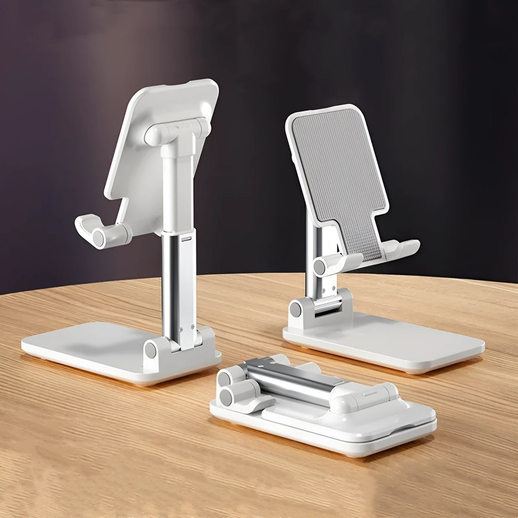 Folding telescopic mobile phone stand in white, blue, green, or pink on a desktop