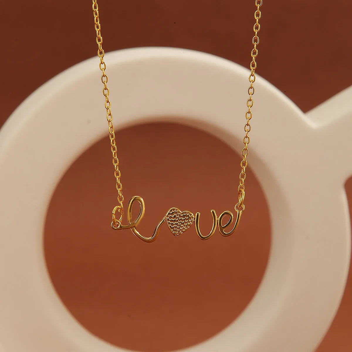 Gold plated copper infinity symbol pendant necklace with sparkling diamond inlay and gold fine chain