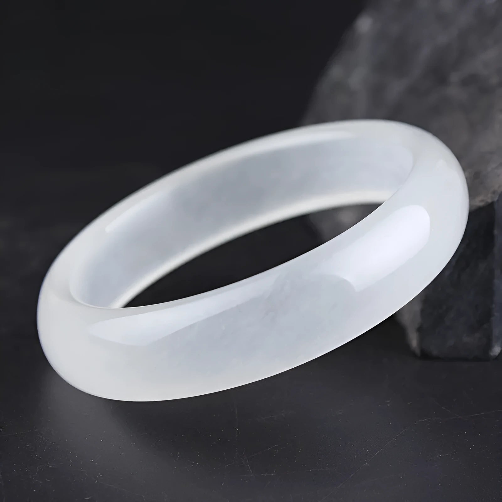 Gao Bing jade bracelet in ice-like white moonlight colour on a wrist, showing flat rod and round rod style options.