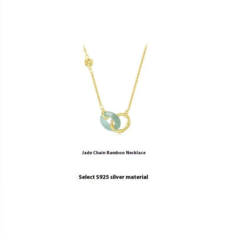 Sterling silver bamboo joint peace buckle necklace with geometric O-ring chain on grey background