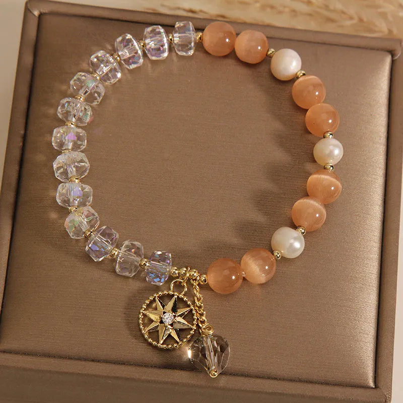 Orange eight-point star opal crystal bracelet with gold-plated settings