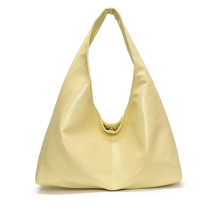 One shoulder tote bag in cream yellow with square vertical shape, outer slit pocket, internal phone bag, PU outer and polyester lining