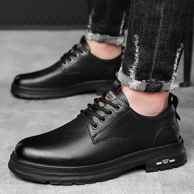 Retro men's casual leather-style shoes in black with round toe and visible stitching