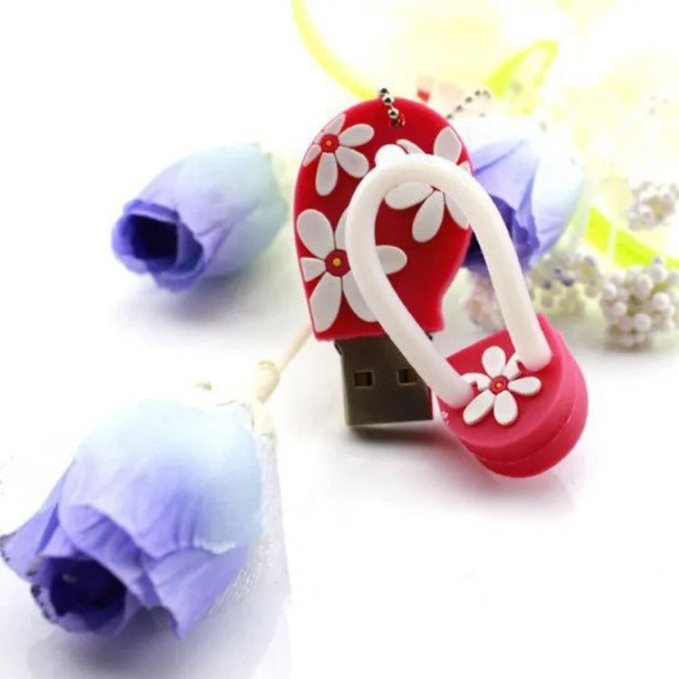 Colourful silicone beach shoe shaped USB flash drive on a white background.
