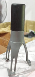 Green Uutensil Stirr automatic handheld mixer for pots, showing its compact size.