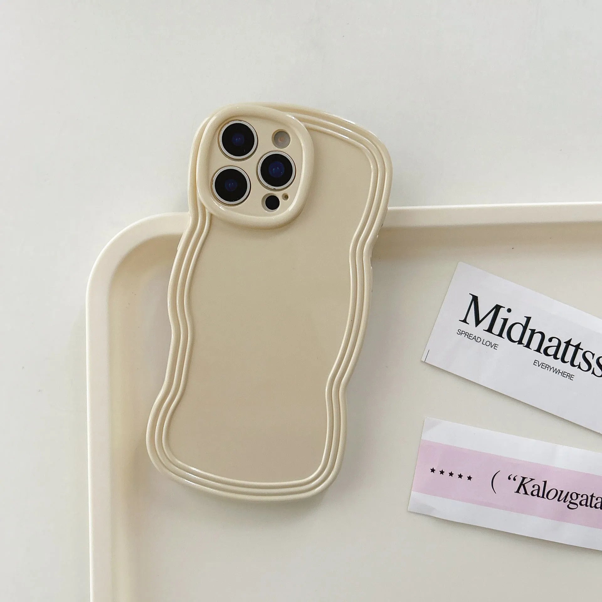 Wave pattern iPhone case in cream candy colour showing TPU material and anti-fingerprint surface