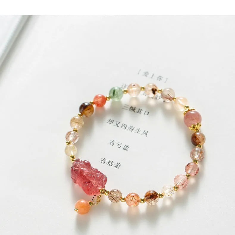 Strawberry quartz crystal bracelet with copper construction and pearl accents in dopamine crystal colour