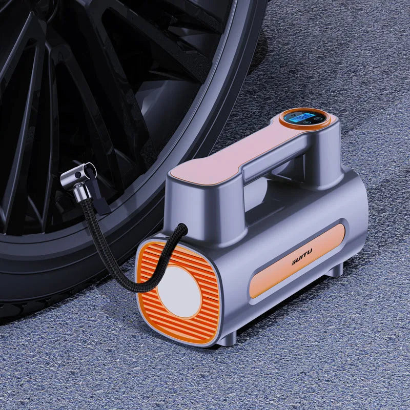 Black portable cordless tyre inflator with digital LCD screen on a grey background