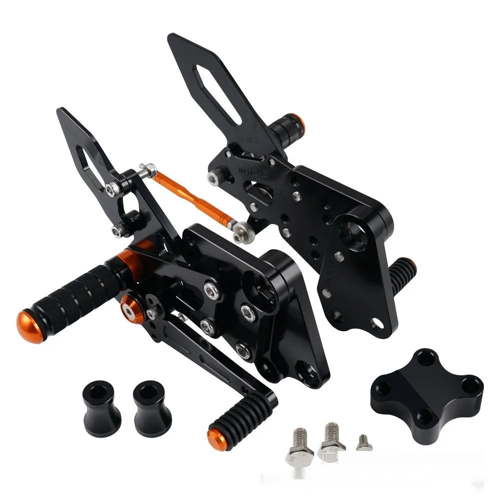 KTM Duke foot pedal bracket assembly for raised rear shift pedal in black or orange