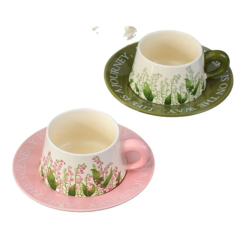 Ceramic coffee cup set with two mugs, saucers, and spoons in Campanula or Lanling Grass designs
