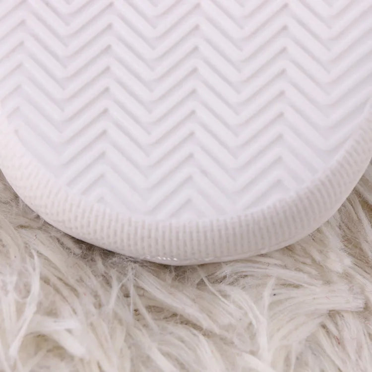 White cartoon pattern plush slippers with toe holder and non-slip rubber sole