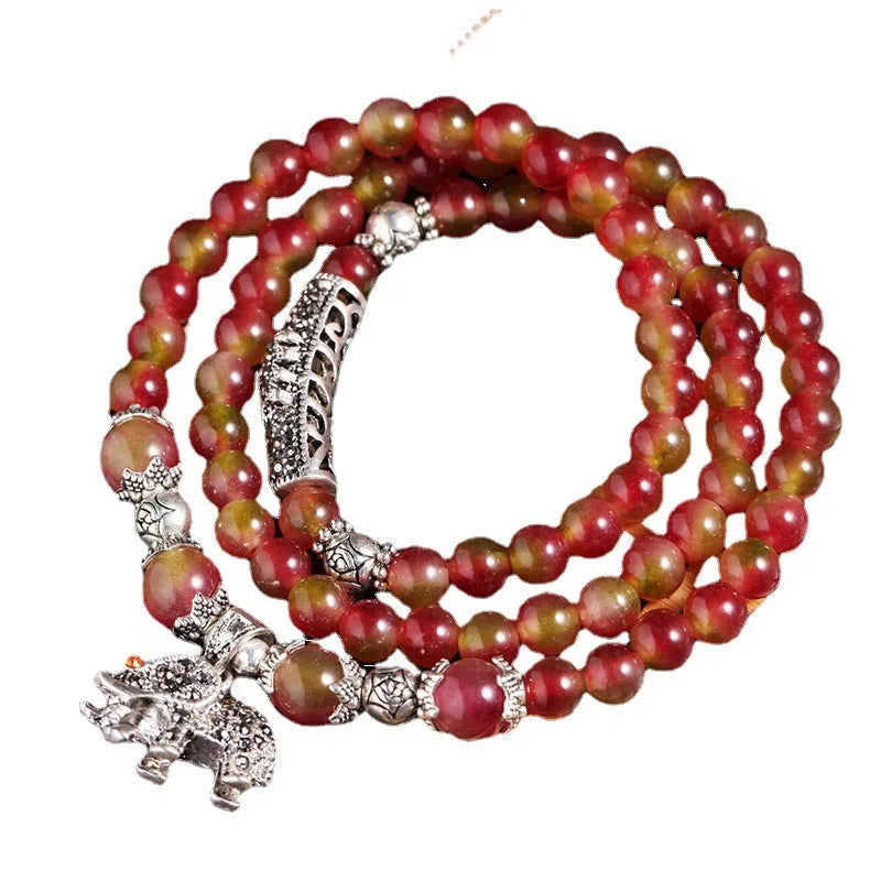 Handmade natural watermelon crystal Chinese knot bracelet in geometric elephant style.