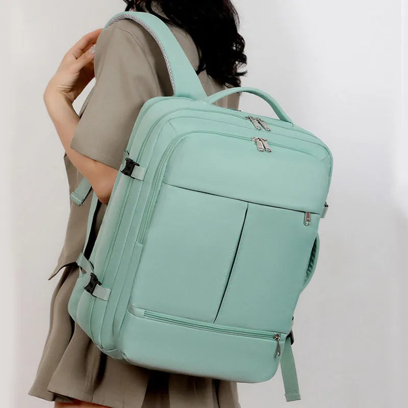 Large waterproof Oxford cloth backpack in a choice of colours, shown with multiple zippered pockets and a 15.6-inch laptop.