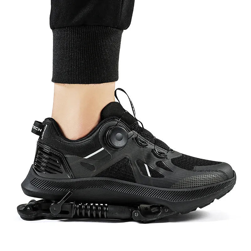 Black running shoes with mesh upper and buckle closure, showing leather stitching details and rubber EVA sole