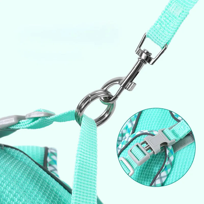 Step-in no-pull dog harness with attached leash, made from breathable mesh with reflective strips and a plastic quick-release buckle.