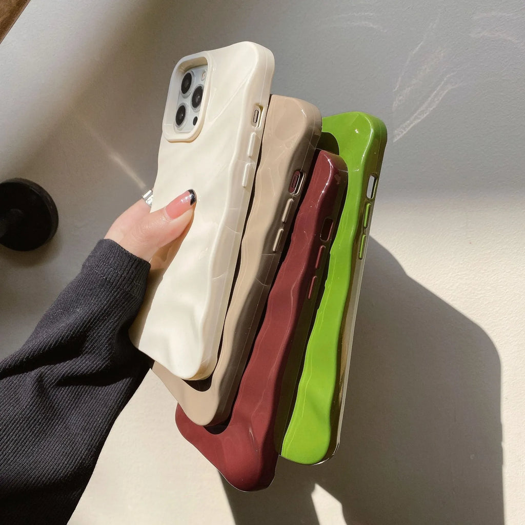 Wave patterned soft TPU phone case for Apple iPhone in burgundy colour showing anti-fall design.