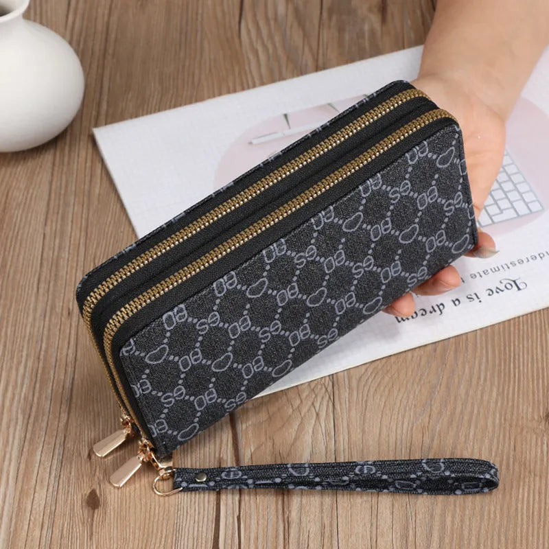 Long PU leather wallet clutch with zip closure and retro print decoration showing internal compartments