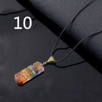 Chakra-inspired acrylic pendant with a unique geometric design and natural variations in the stone patterns