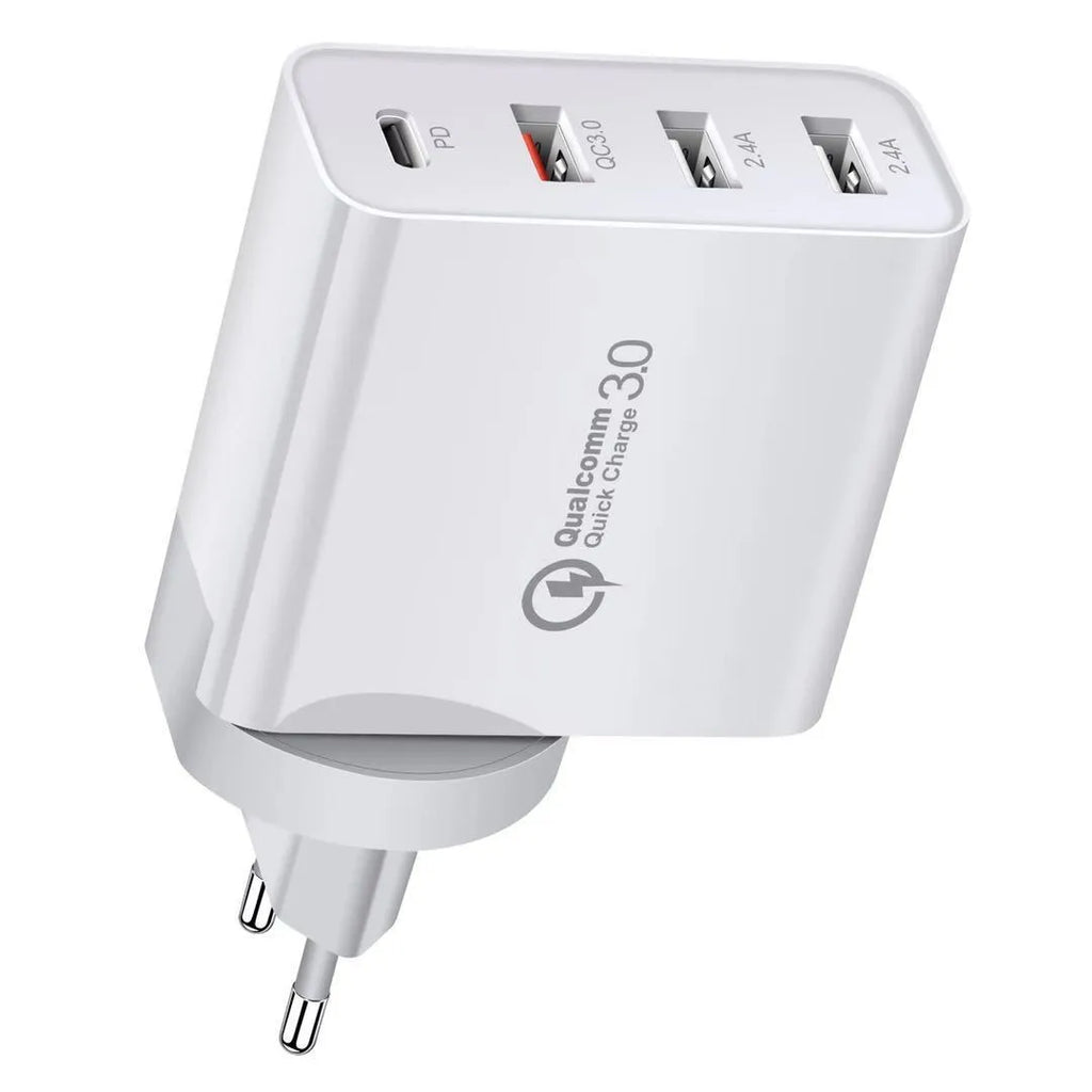 White 4-port USB fast charger with UK plug on a wooden surface.