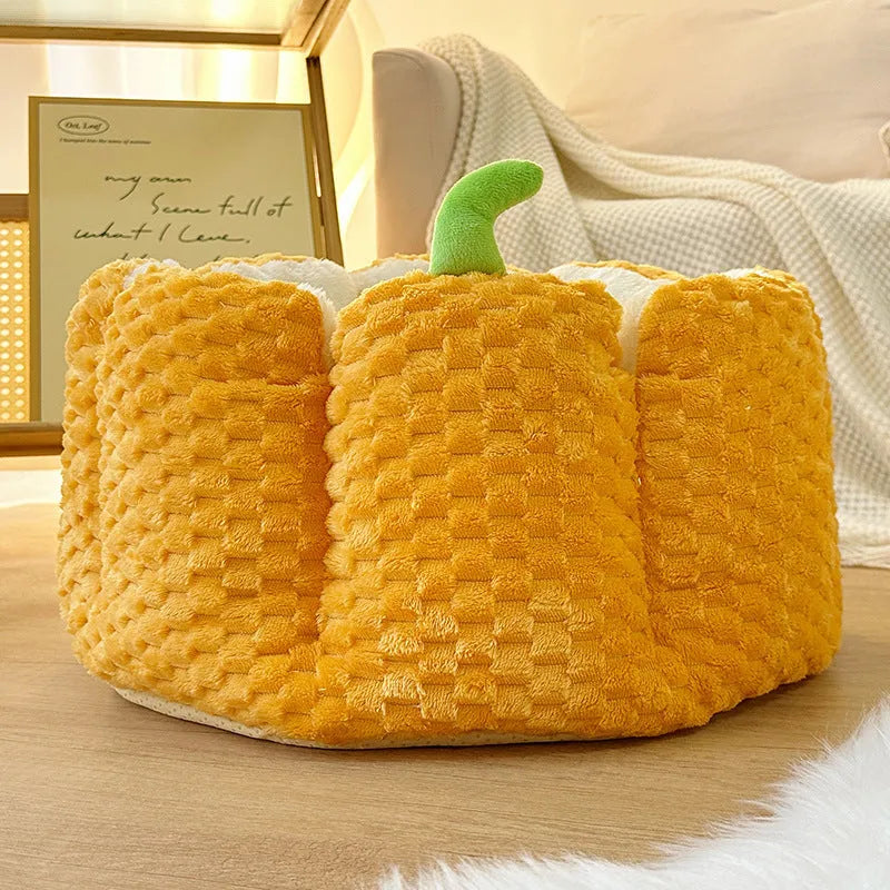 Pumpkin-shaped cat bed with raised rim showing interior cotton filling