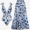 Women's printed one-piece swimsuit with sleeveless design, polyester fabric and optional matching skirt in sizes S to XL.