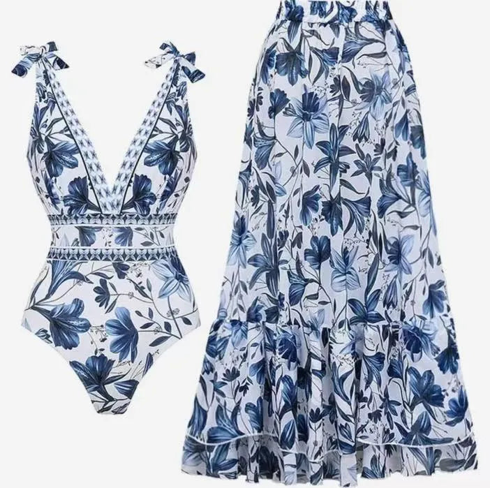 Women's printed one-piece swimsuit with sleeveless design, polyester fabric and optional matching skirt in sizes S to XL.
