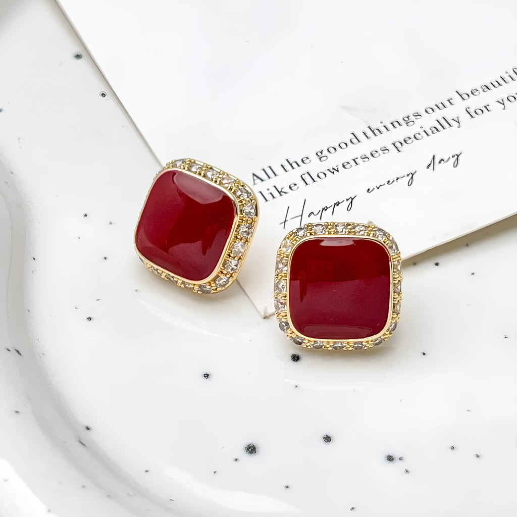 A pair of retro red square geometric alloy earrings with an inlaid design detail.