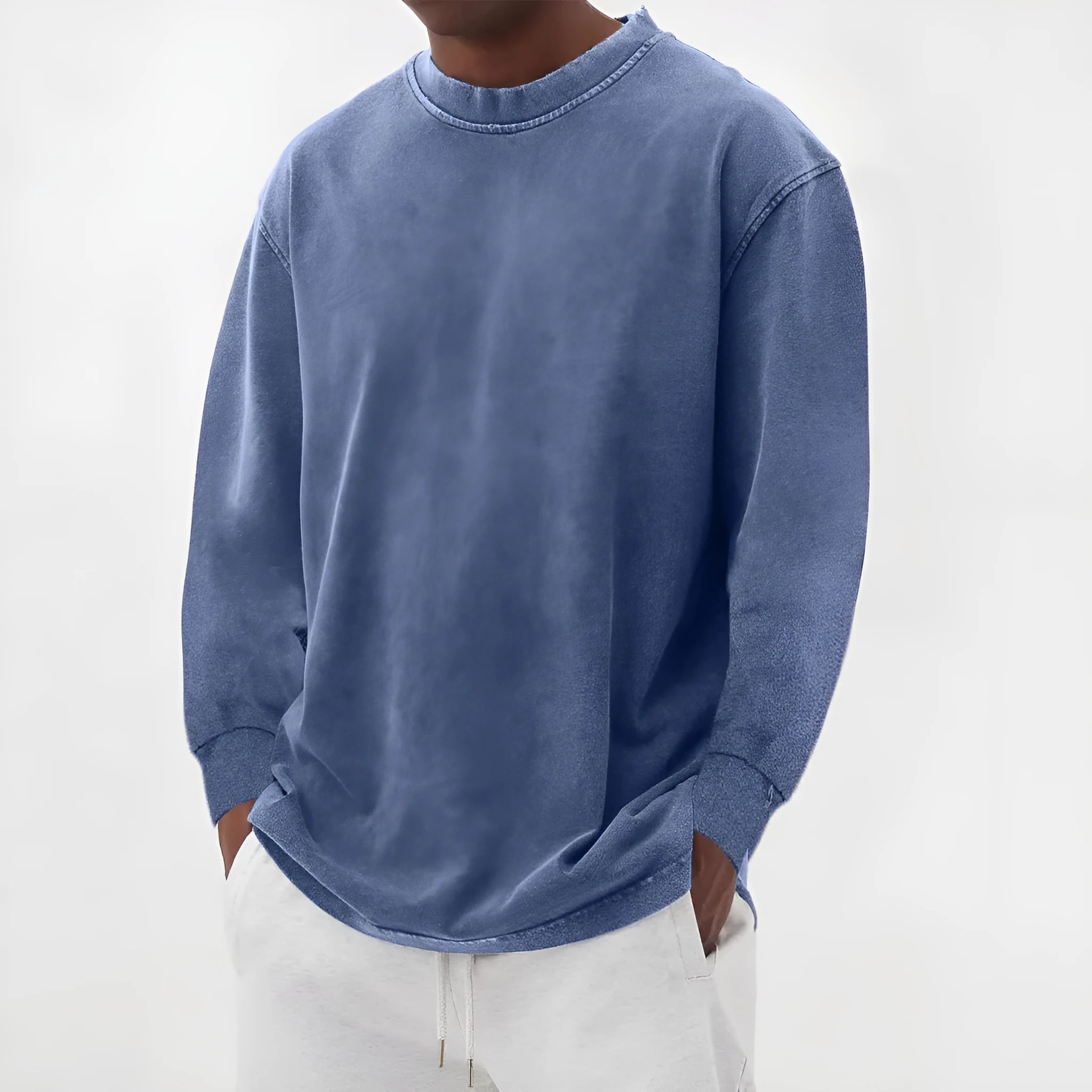 Man wearing a slim fit long sleeve t-shirt in a solid colour, with options in sky blue, green, gray, black, and camel.