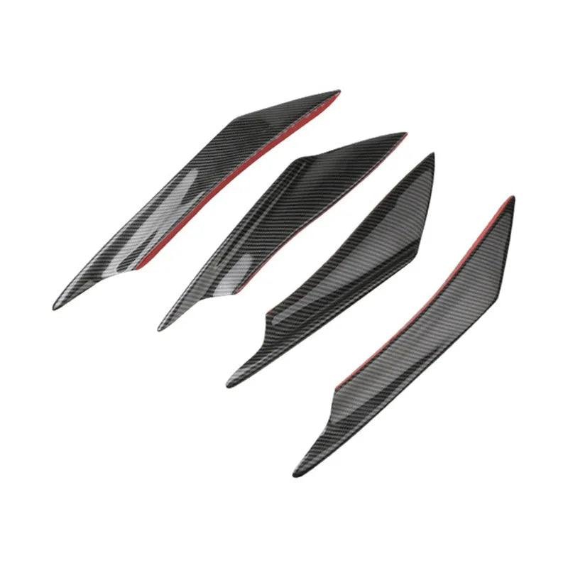 Set of four ABS plastic bumper air knife spoilers in a carbon fibre finish for car modification.