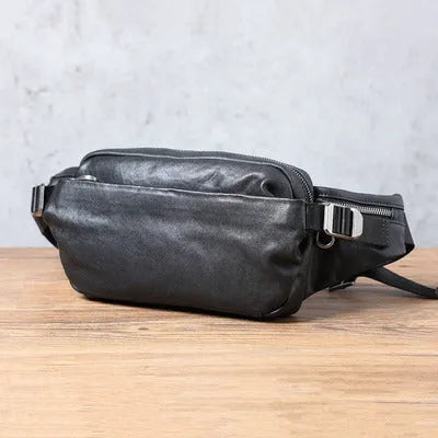 Men's small cowhide cross-body fanny pack in black, horizontal square shape, single shoulder strap
