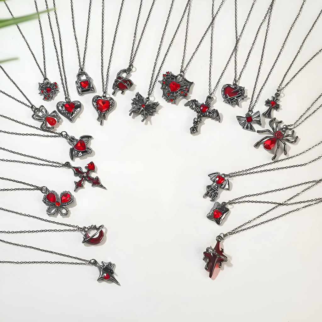 Silver electroplated gothic Halloween necklace with bat and spider pendant designs on a chain.