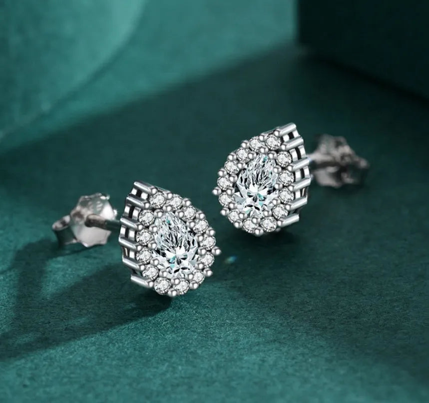 Women's drop shape ear studs in 925 sterling silver with diamond treatment