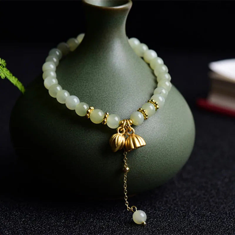 Natural Hetian jade bracelet with lotus carving and fu symbols on 6mm beads