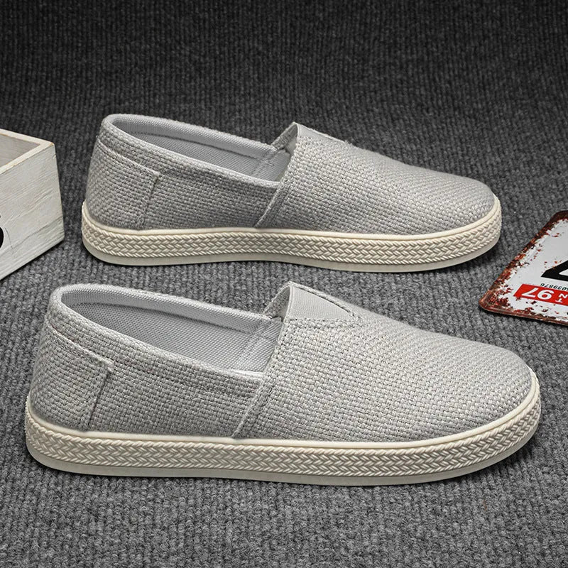 Men's linen-style cloth shoes in canvas with PVC soles showing round toe and sewing thread details