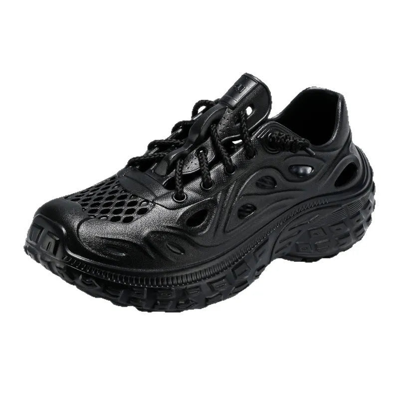 Men's black EVA sandals with a hollow out design and thick sole, shown on a foot.