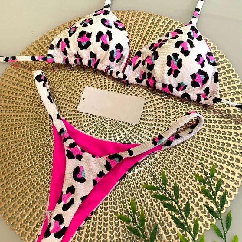 Women's printed lace-up split bikini set in nylon, available in six prints and sizes S, M, L.