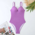 Women's black sunken stripe one-piece swimsuit with sleeveless design for swimming