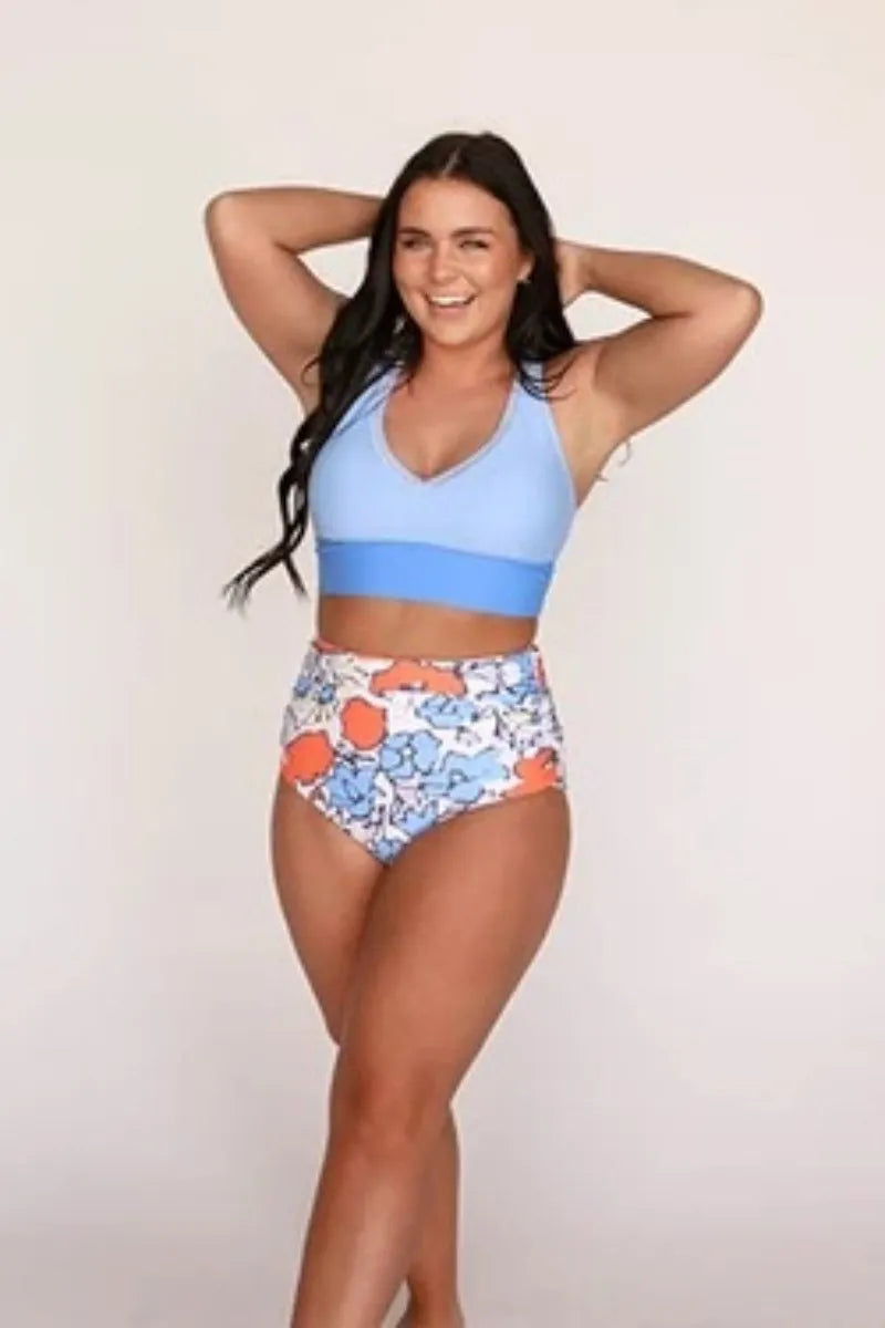 Women's conservative blue polyester one piece split swimsuit with vest top and full coverage