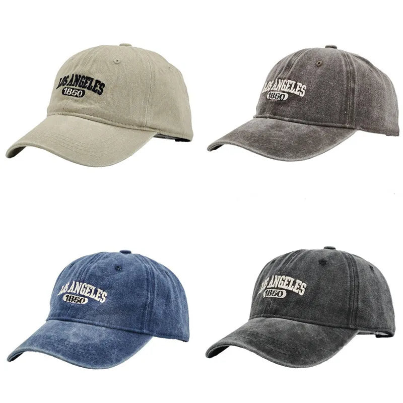 Retro distressed acrylic cap with embroidered letters, shown in beige colour with adjustable strap.