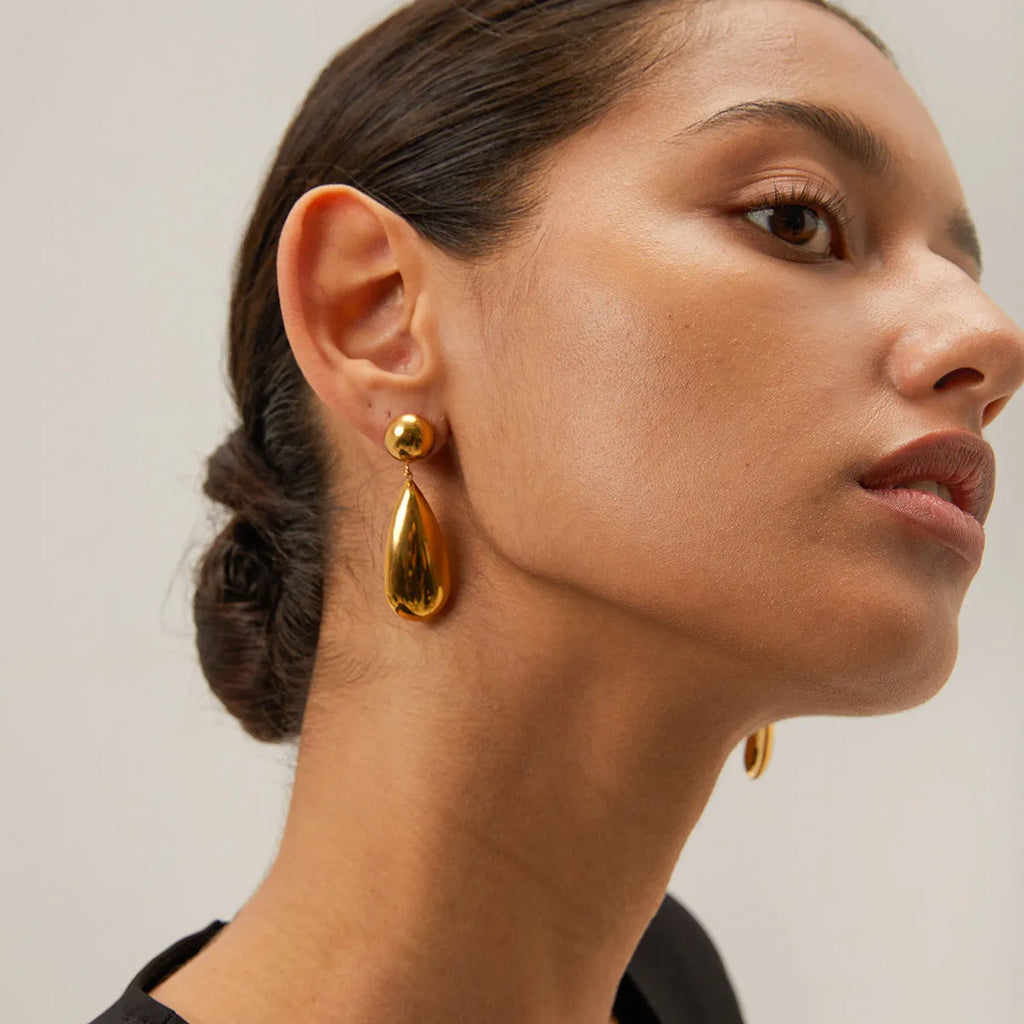 Gold electroplated stainless steel hemisphere earrings with water drop pendant design for women