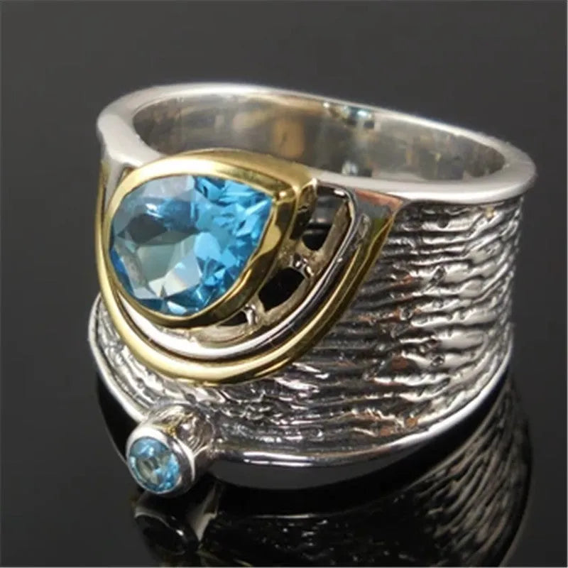 Blue rhinestone zircon ring with a Chinese style drop shape on an alloy band.